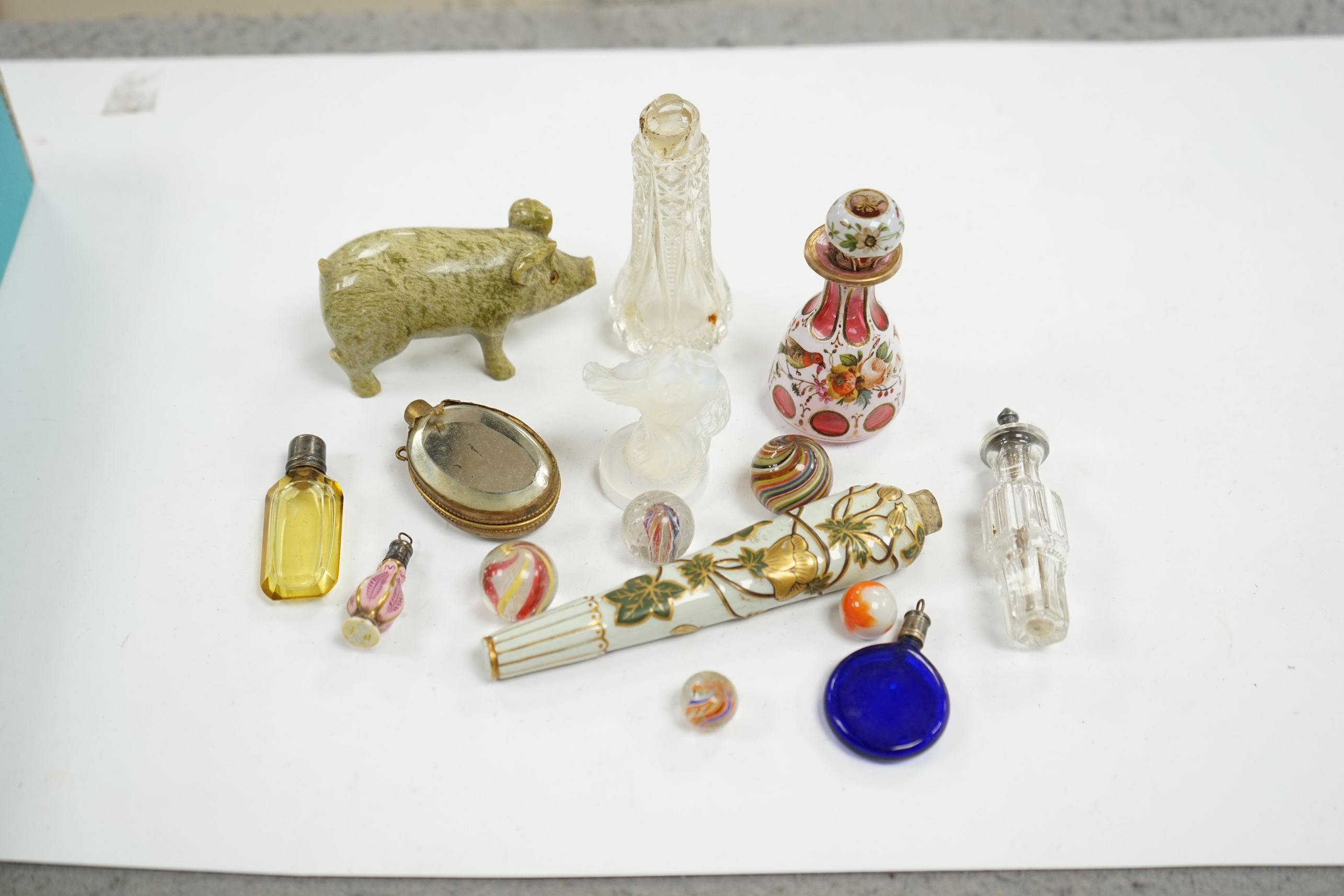 Miscellaneous Victorian scent bottles, a novelty miniature glass chamberpot, a Sabino-type opalescent glass fish model, etc, largest 12.5cm in length. Condition - mostly poor to fair